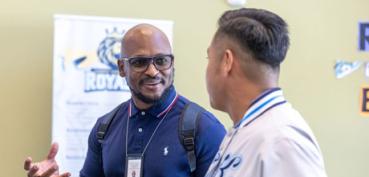 Two teachers speaking with one another